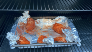 Smoked Barbecue Chicken Lollipops on smoker